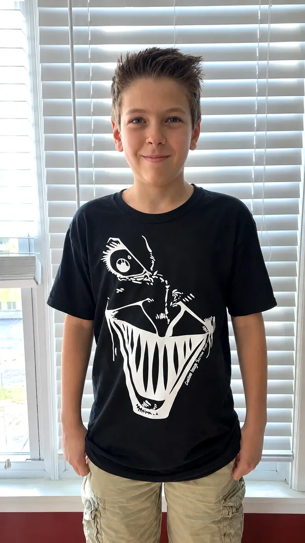 Black T-shirt with a bold white line-art face